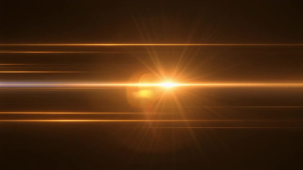 Flare anamorfico dorato in movimento su sfondo scuro