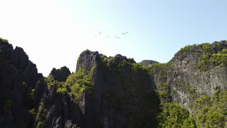 Dramatic-aerial-rising-shot-over-the-limestone-Palawan-Cliffs,-Philippines