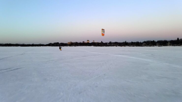 wind surfing over a frozen lake, winter sports in Minnesota, explore only in MN, travel enjoy live keep the north cold