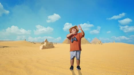 child taking selfie in the egyptian desert