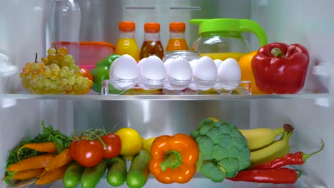 Open-refrigerator-filled-with-food