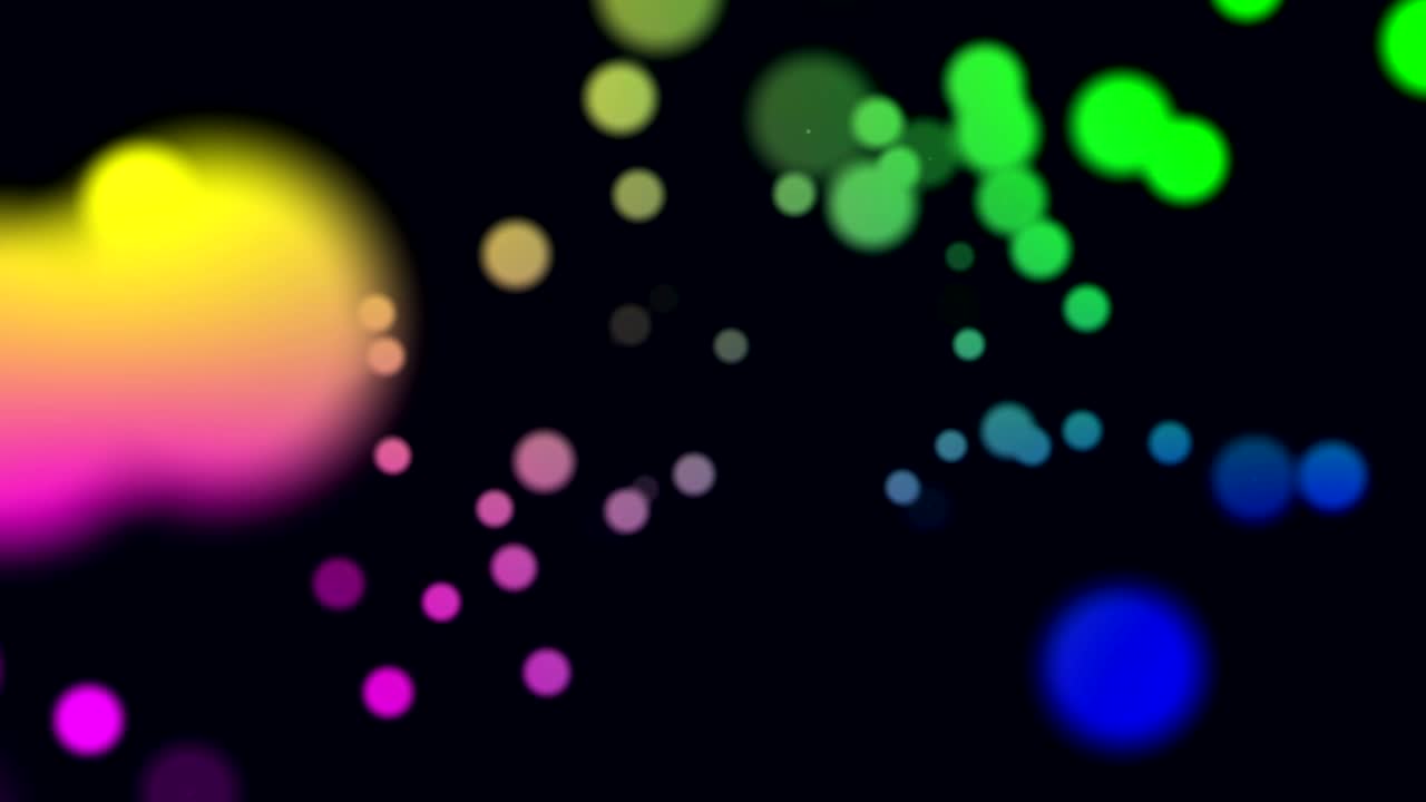 Animation of multi coloured glowing spots of light moving in hypnotic motion on black background