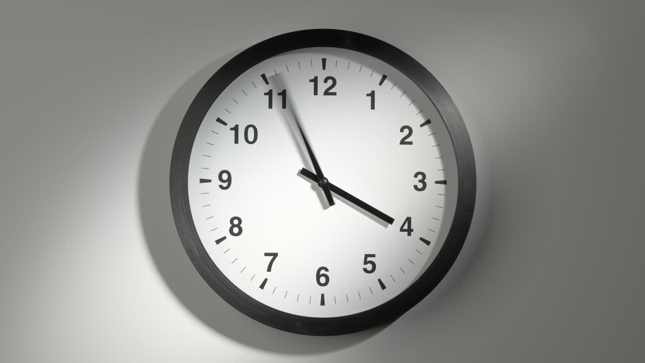 Clock Face in Time Lapse on White Wall in Office