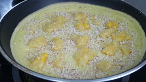 apam balik or malaysian peanut pancake turnover.  flour pancake stuffed with sugar and corn topping. cooked using the hot pan. famous street food in malaysia