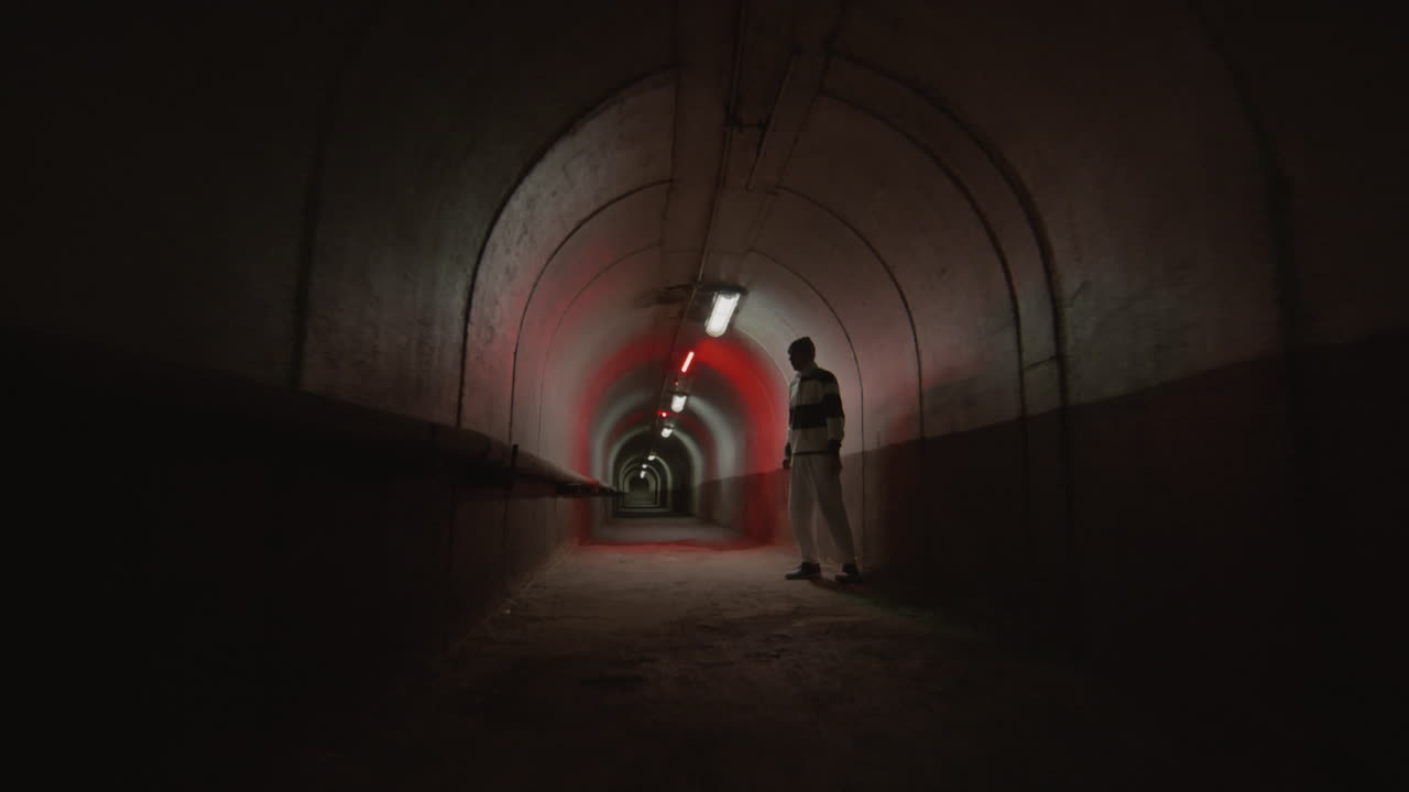Parkour Athlete Doing Side Flip off Tunnel Wall