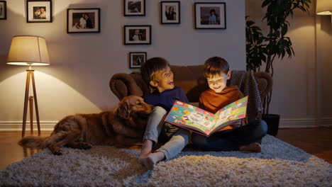 two brothers reading a book with a dog