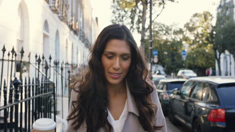 beautiful indian woman walking through city