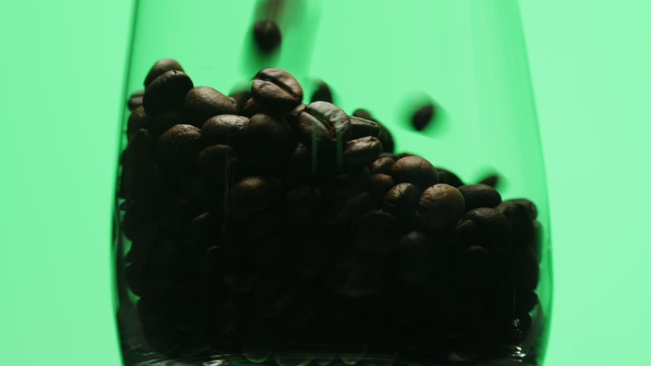 Coffee Beans Falling into Glass on Green Screen