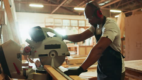 a carpenter working with a power saw in a workshop