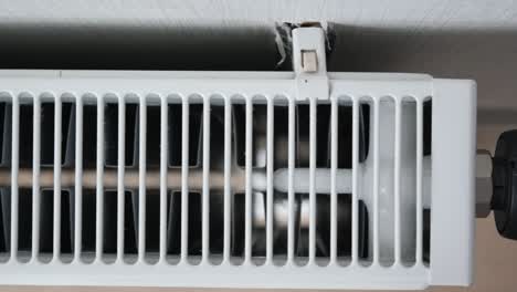 close-up of a white wall-mounted radiator