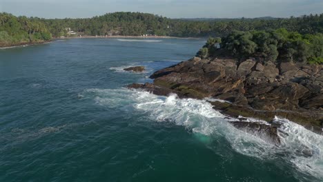 Establishing-Aerial-Drone-Shot-of-Hiriketiya-Beach-and-Headland-in-Southern-Sri-Lanka-Tropical