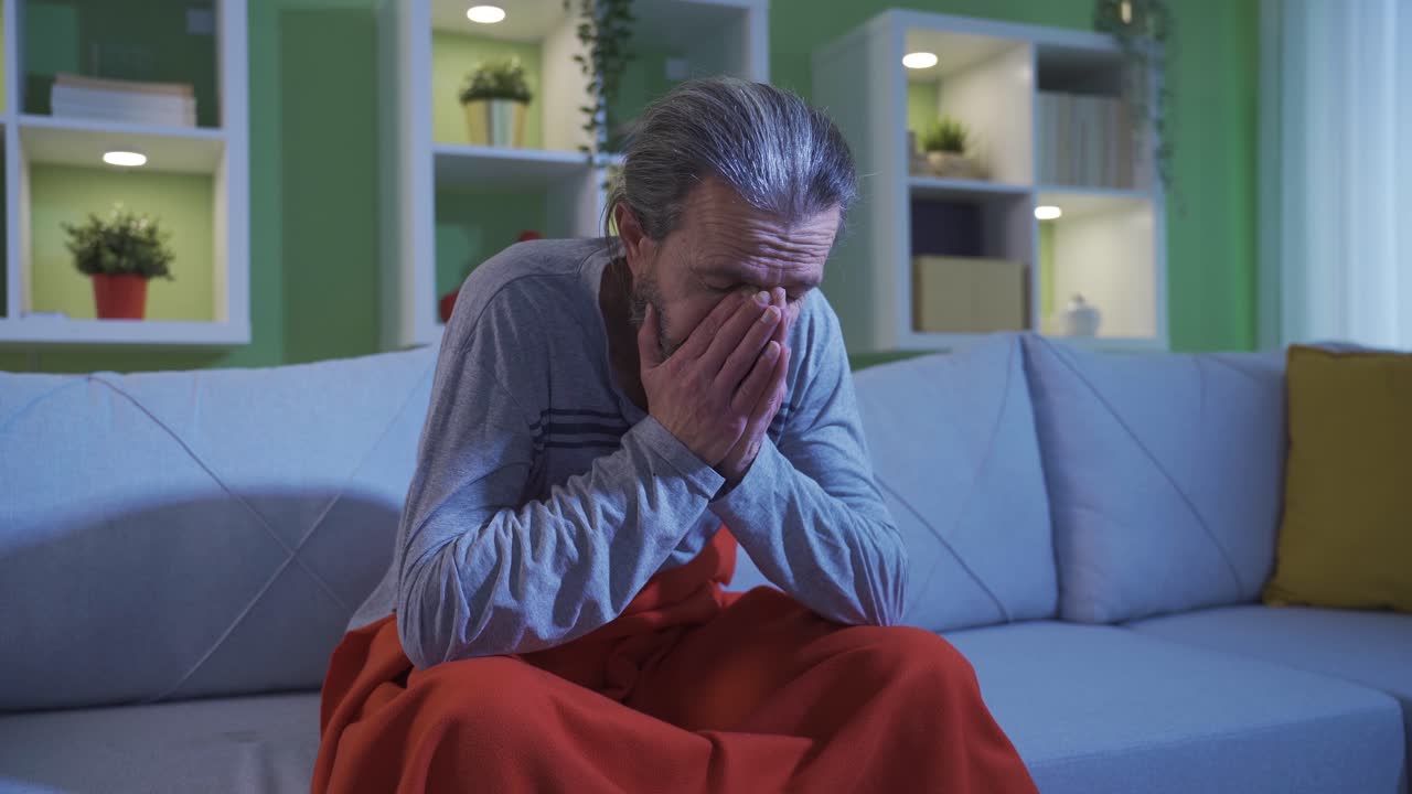 Depression anxiety. Annoyed thoughtful old man can't sleep at home until late.