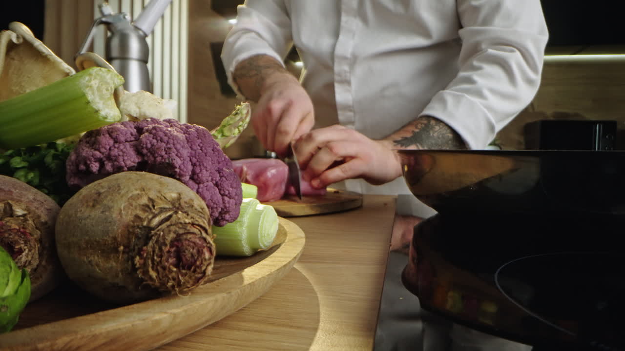 Chef preparing meat and vegetables