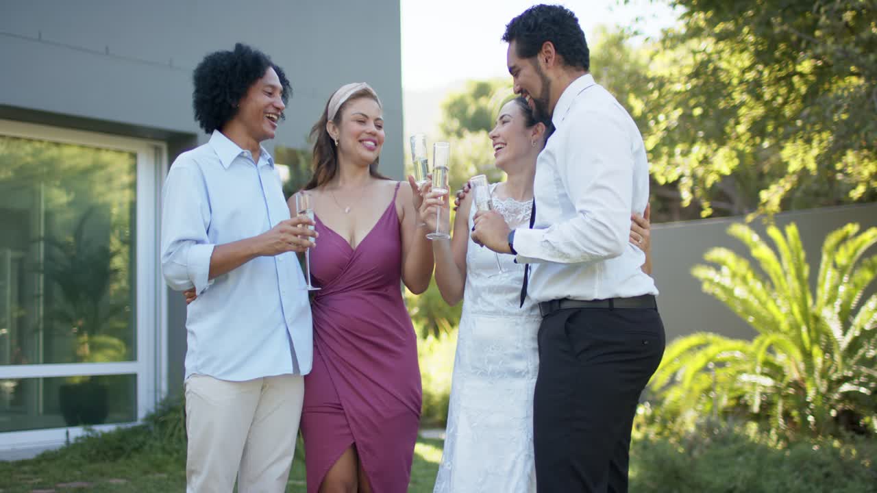 African American newlyweds, magenta dress friend raising flute, clinking flutes in yard for wedding