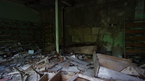 destroyed furniture and bookshelves in abandoned commercial building, pripyat