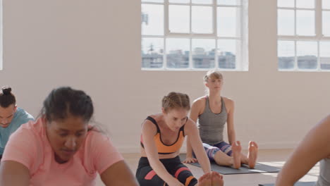 yoga class group of young multiracial people practicing poses enjoying healthy lifestyle exercising in fitness studio