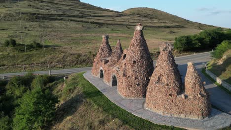 Aerial-orbits-Bells-of-Goris-Monument-represents-mountains-in-Armenia