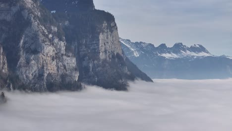 Sichelkamm-Cliffs-Shrouded-in-Fog,-Switzerland---aerial