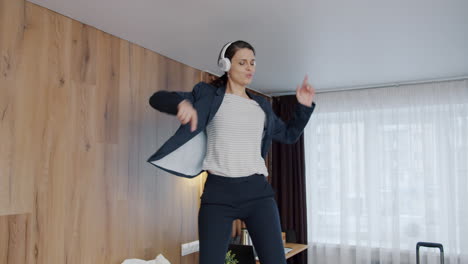 businesswoman dancing in a hotel room