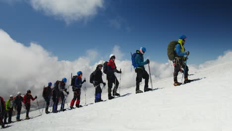 mountain climbers on snowy summit