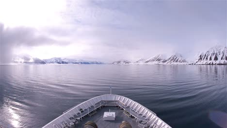 bow point of view of an icebreaker ship sailing through calm waters in woodfjorden in svalbard archipelago norway