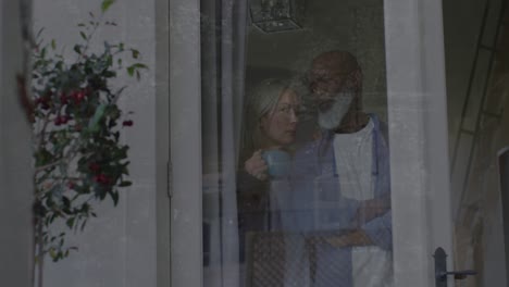 animation of moving background over sad senior diverse couple embracing