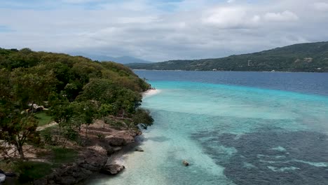 Drone-footage-of-crystal-clear-blue-water-and-waves-on-the-shore-of-beach-in-Cebu-Philippines-10