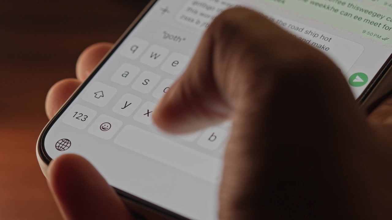 Man hands chatting and typing on smartphone macro closeup. Unrecognizable human typing text message tapping touchscreen keyboard using whatsapp application a social media.