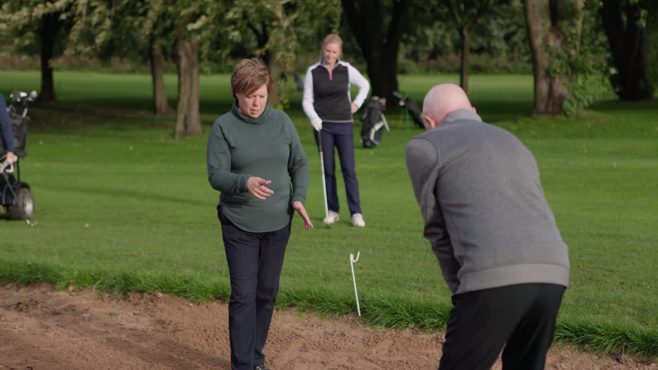 People playing golf on a golf course