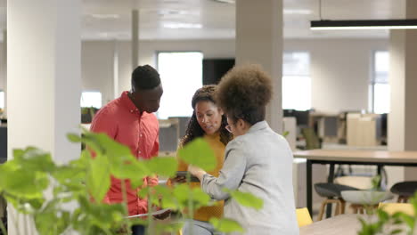 casual diverse businesspeople talking in office, slow motion with copy space