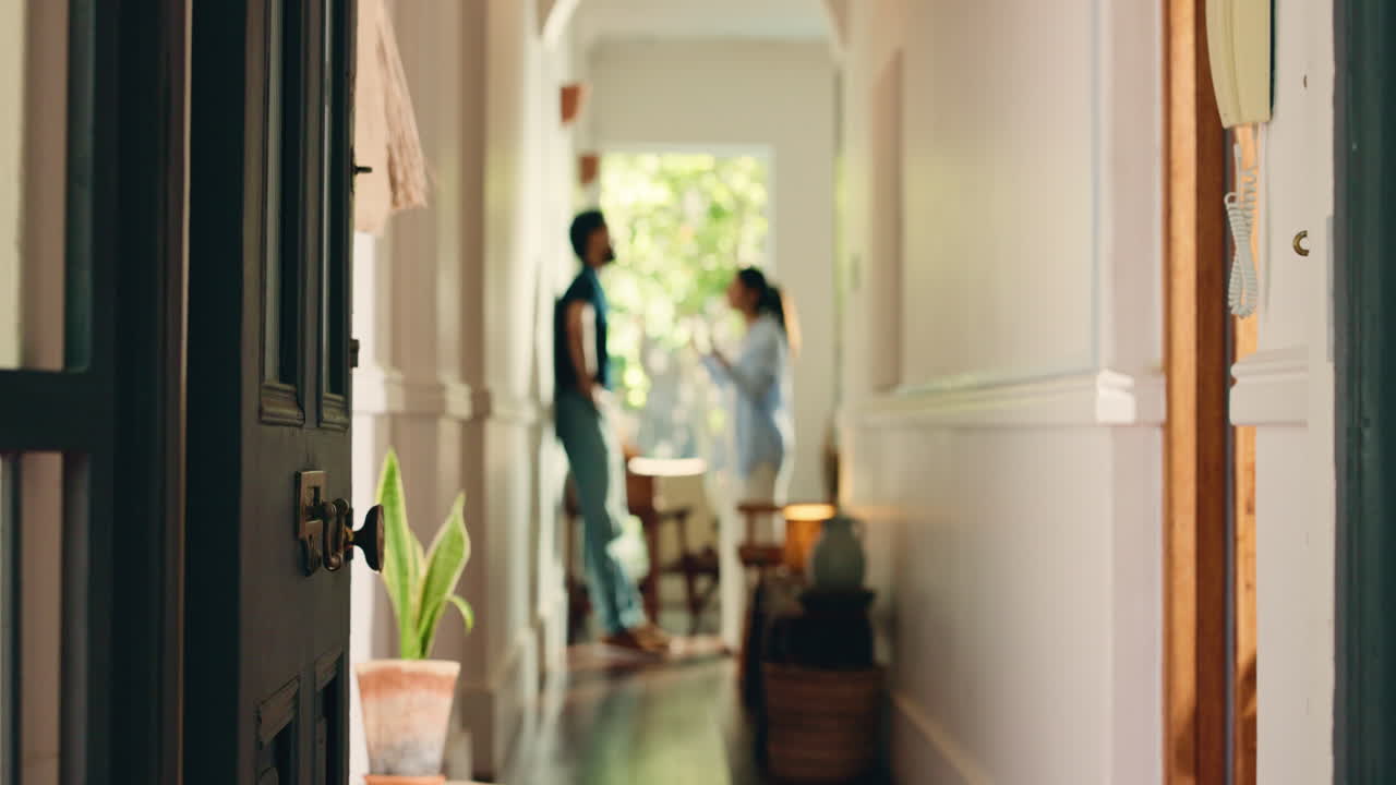 View Through Open Door of Home Hallway with Blurred Couple