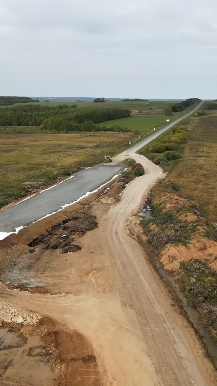 Aerial View of New Road Construction Next to an Existing Highway