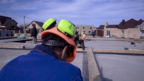 construction workers assembling roof structure