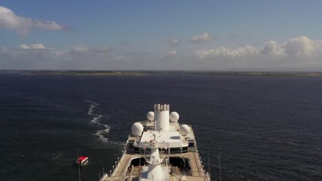 Dynamic aerial shot of the luxurious Azamara cruise, showcasing its front and top-down view of the pool