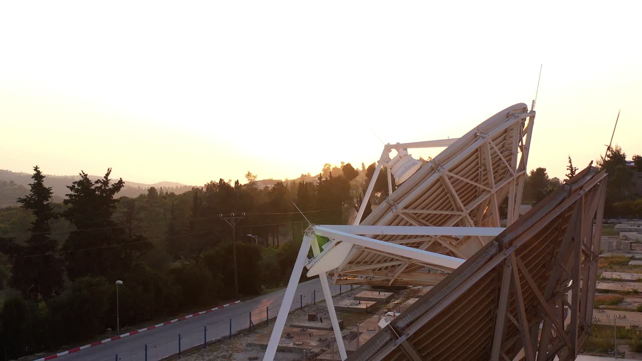 Satellite Dish at Sunset over Hills