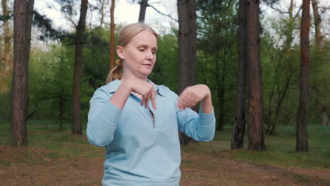 woman practicing tai chi in a forest