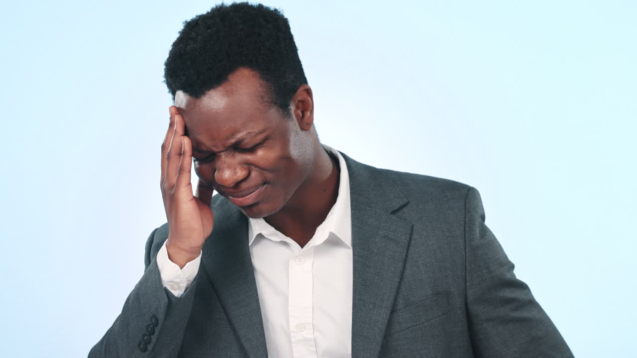 Headache, studio face and professional black man