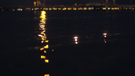 senior couple and candles in night sea