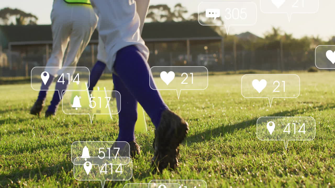 Teenage female players practicing football drills around neon cones, showing floating social icons