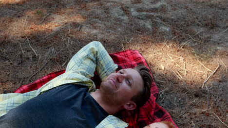 couple lying on blanket in olive farm