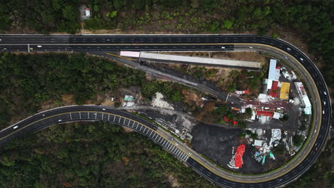 top view drone shot above the pear turn at the mexico-cuernavaca highway in la pera