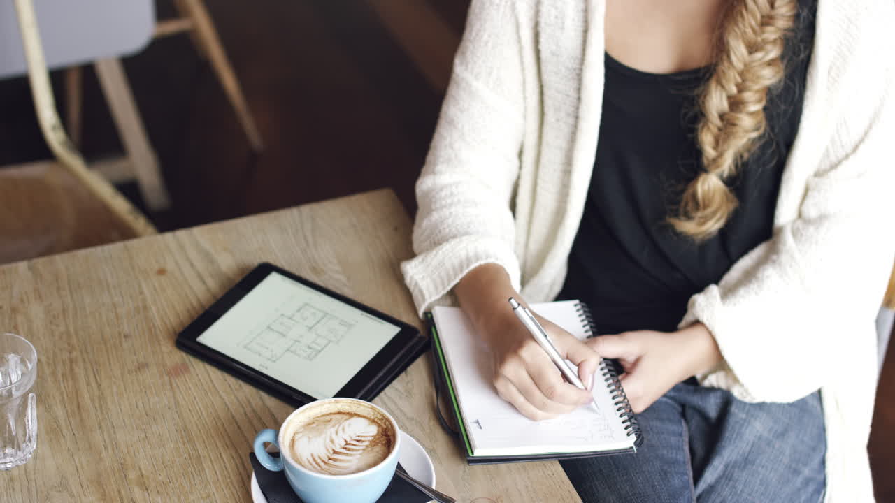 Architect woman working in cafe drinking coffee