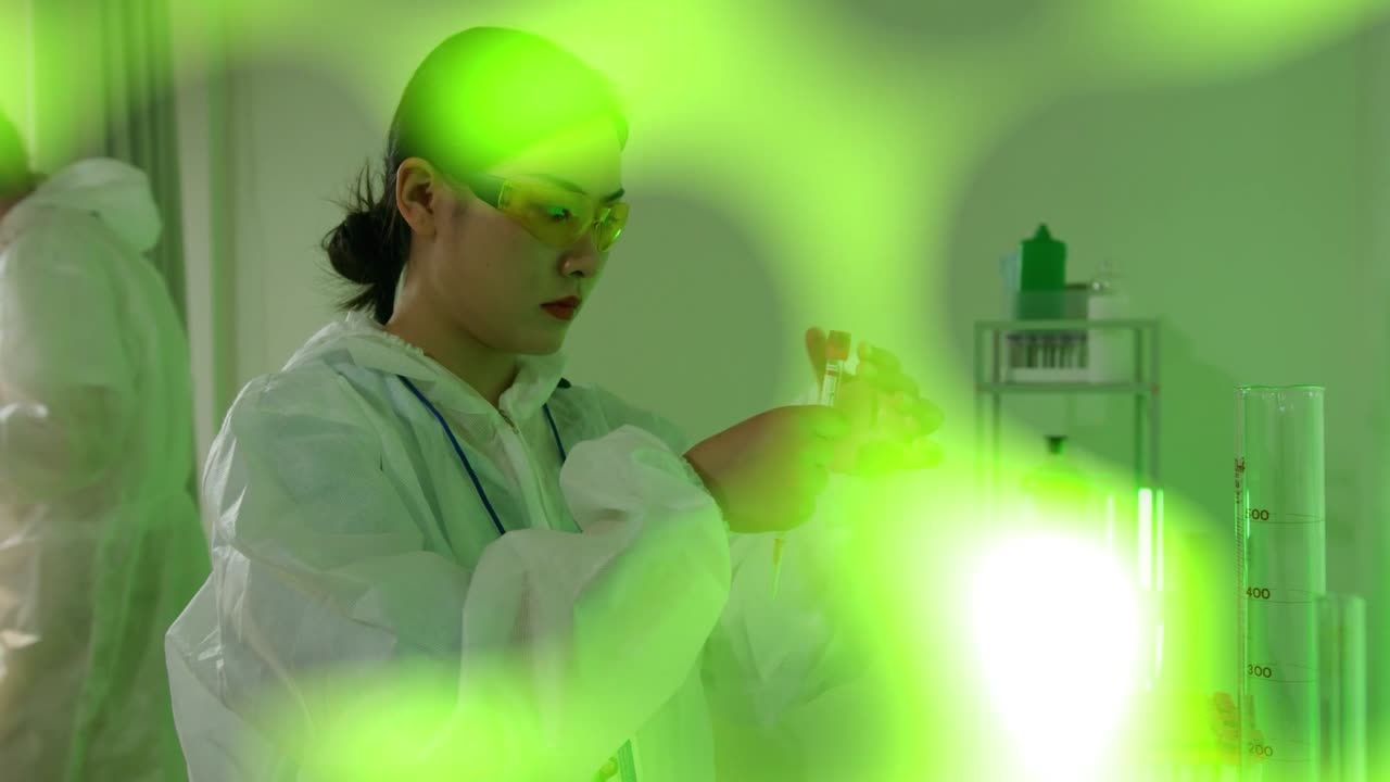 Scientists Working in a Laboratory with Green Light Overlay