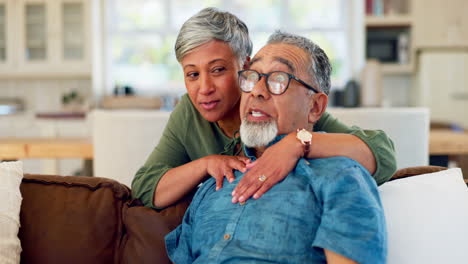 Watching-tv,-old-man-and-woman-hug-sofa-in-lounge