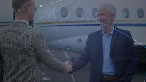 animation of network of connections over businessmen by plane