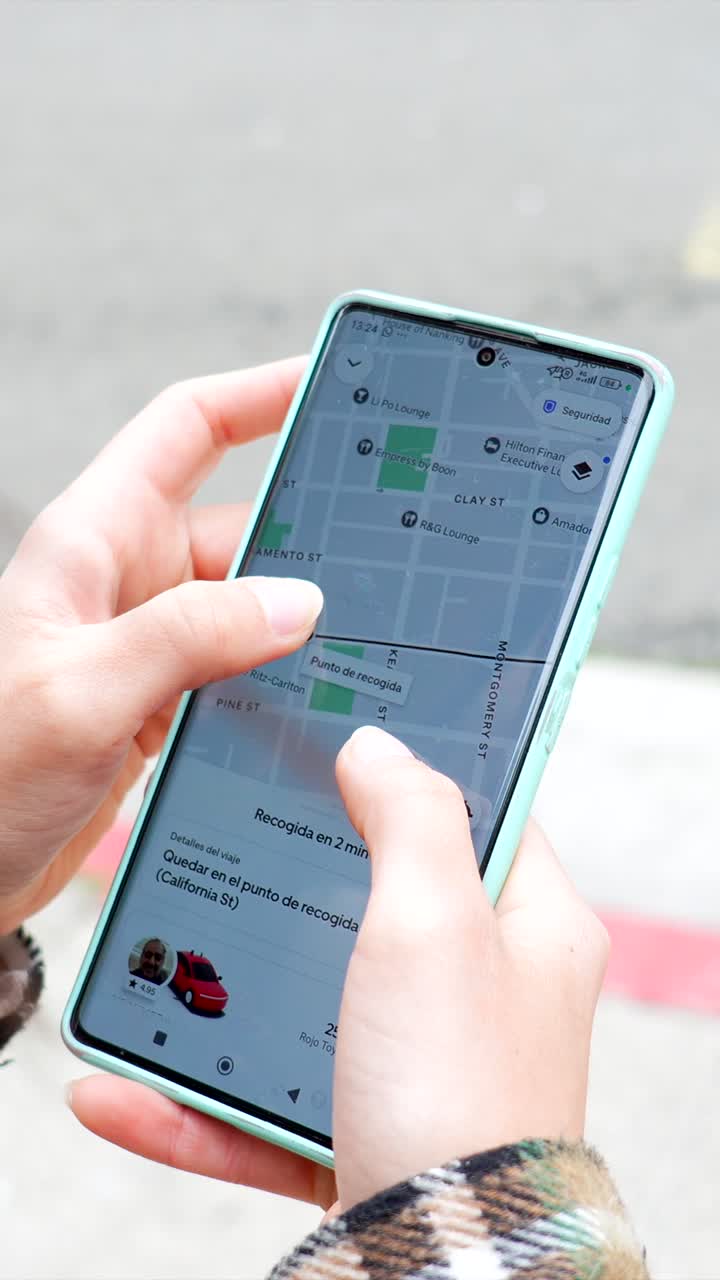 Close Up of Hands Using Smartphone Map Application Outdoors