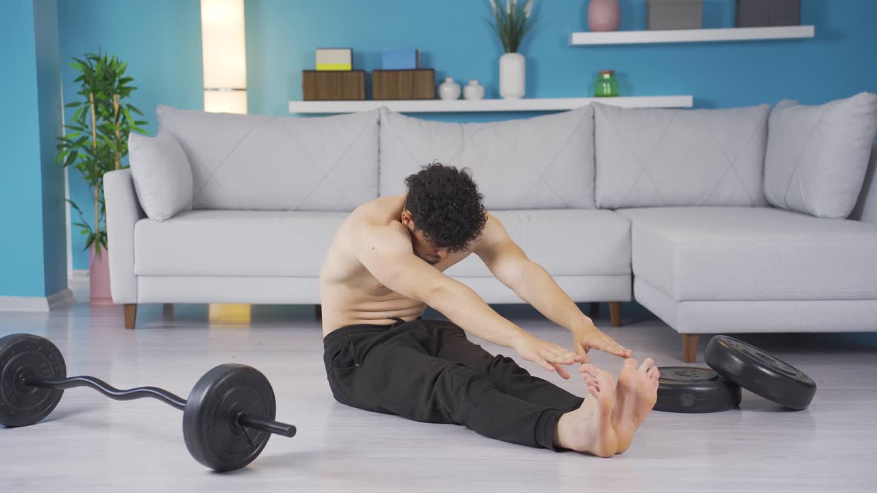 Young athlete man exercising at home. Healthy lifestyle.