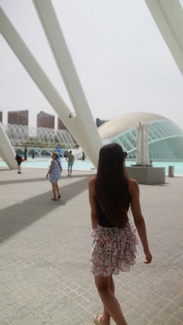 woman walking through a modern city park