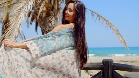 Carefree-Woman-at-the-Beach-Looking-at-Camera