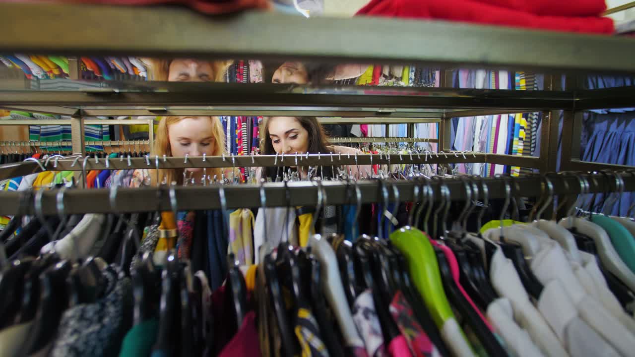 Two Women Shopping for Clothes in a Clothing Store